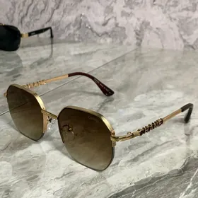 Cartier , Chanel , Gucci ocki