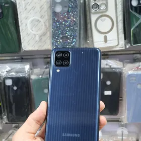Samsung M12  TP Servisinki