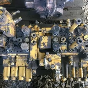 cat eksgewator 320 raspredi
