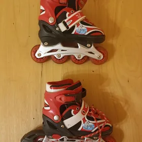 Роликовые коньки