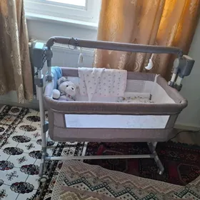 Детская электрическая кроватка