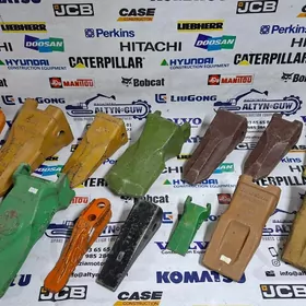 Ekskowatoryň dişleri we adapterlary