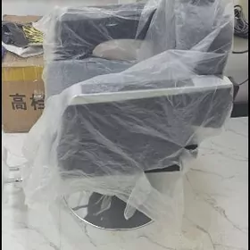 Парикмахерской кресло.