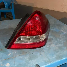 nissan tida versa yzky sag far